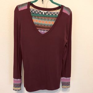 Ladies fashionable L/S tee with woven back.